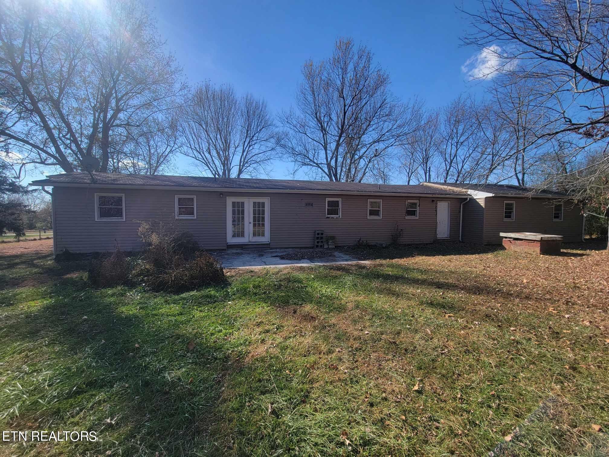 1751 Eldridge Loop Crossville, TN 38571 - Photo 32 of 35 a view of a house with a yard and a large tree