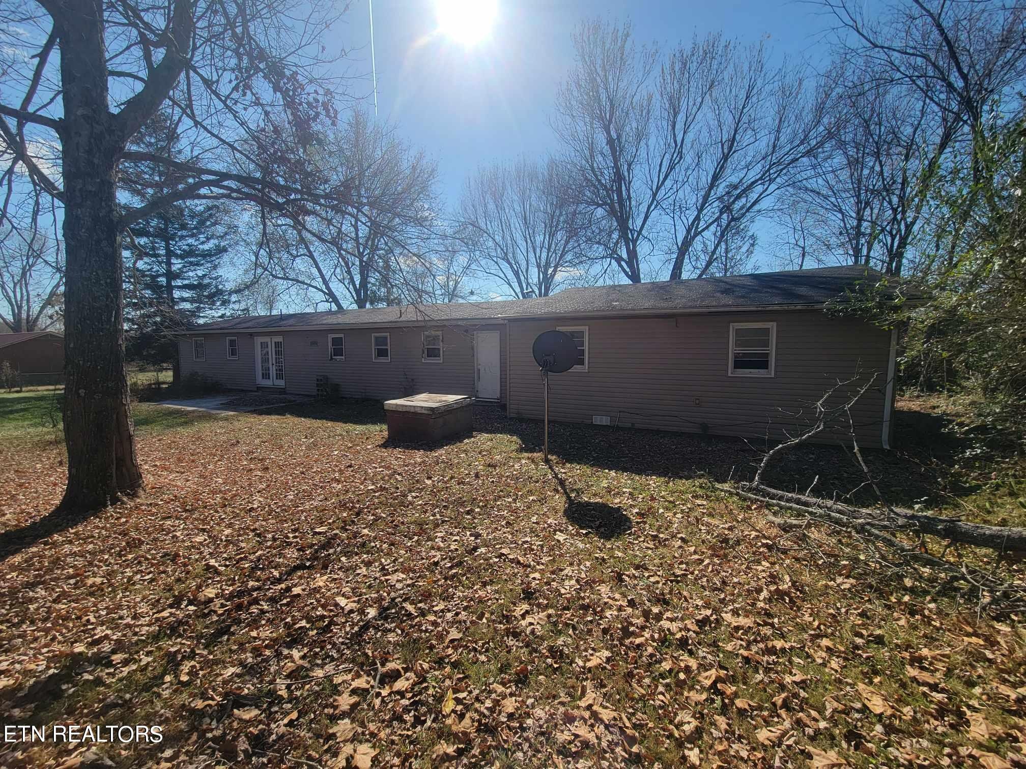 1751 Eldridge Loop Crossville, TN 38571 - Photo 4 of 35 a backyard of a house with lots of green space