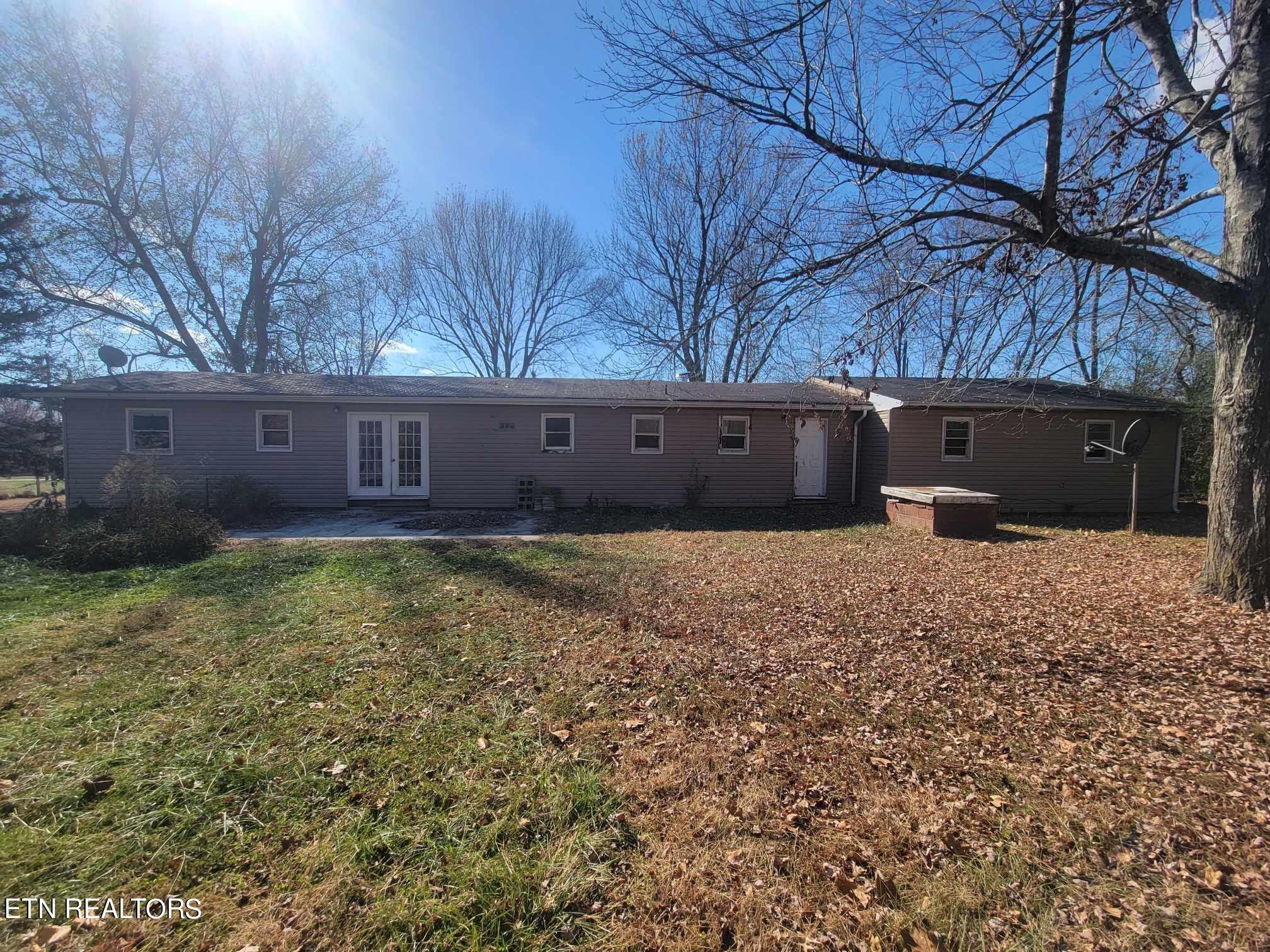 1751 Eldridge Loop Crossville, TN 38571 - Photo 5 of 35 a view of a house with a yard and a large tree