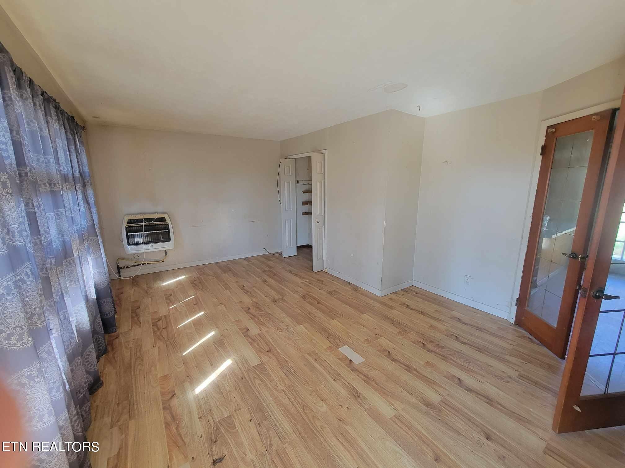 1751 Eldridge Loop Crossville, TN 38571 - Photo 6 of 35 a bedroom with a bed and wooden floor