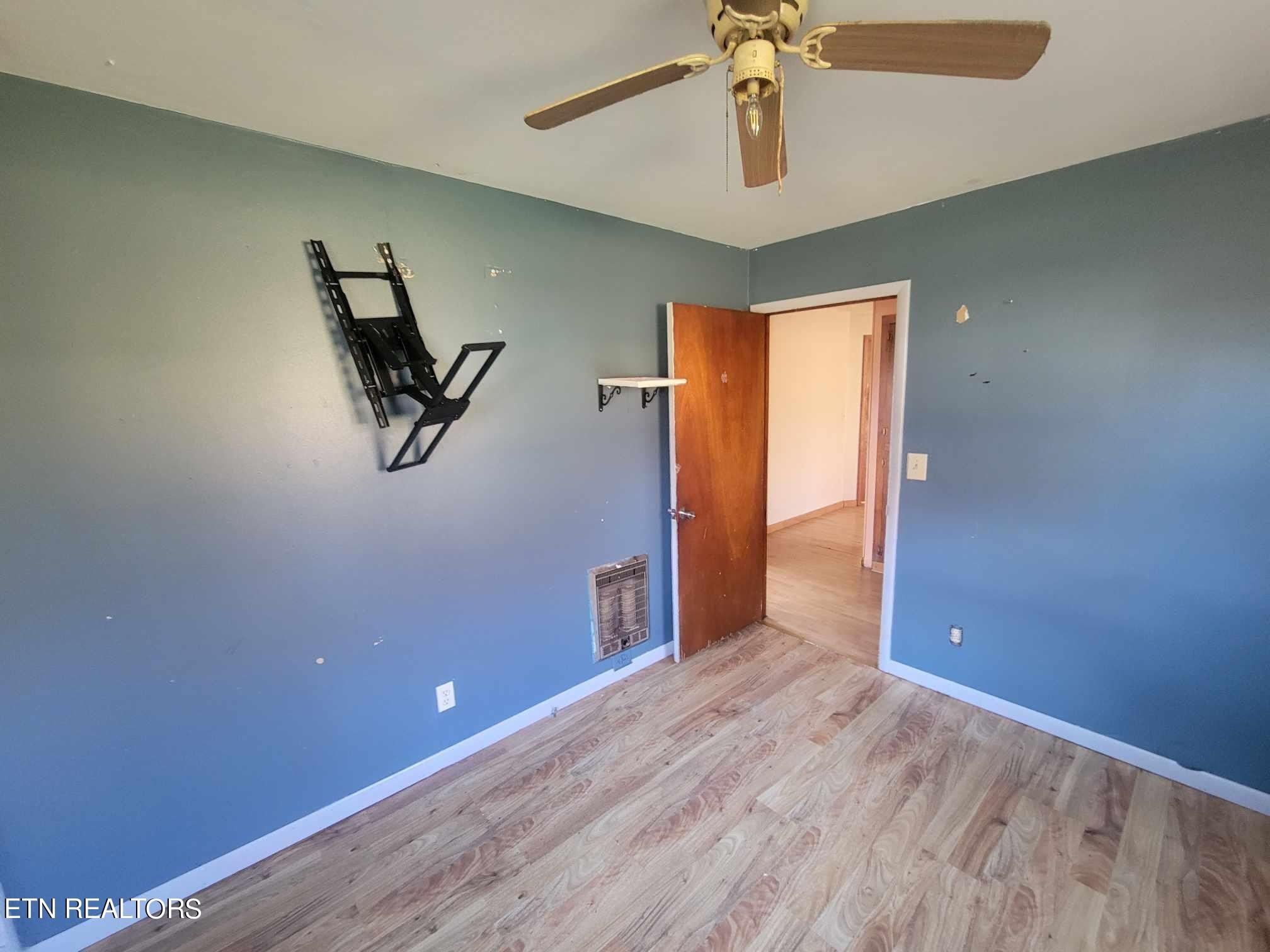 1751 Eldridge Loop Crossville, TN 38571 - Photo 10 of 35 wooden floor in an empty room with a window