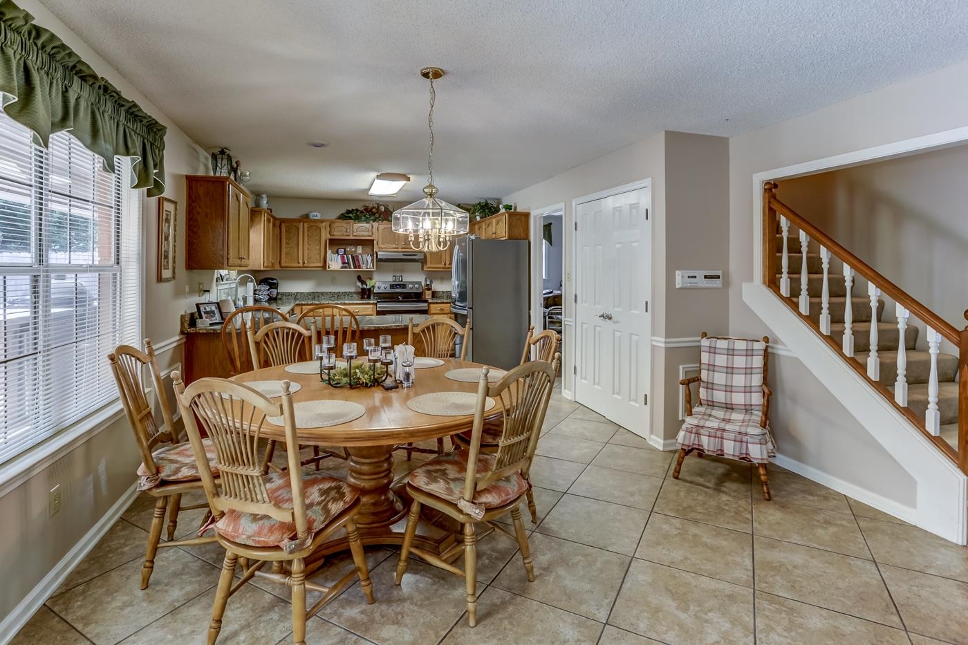 1091 Sugar Lane Collierville, TN 38017 - Photo 12 of 25 a view of a dining room with furniture window and wooden floor
