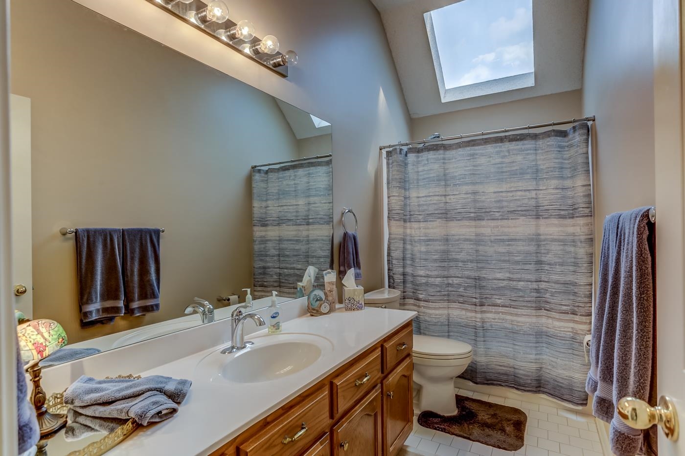 1091 Sugar Lane Collierville, TN 38017 - Photo 15 of 25 a bathroom with a sink a toilet and shower