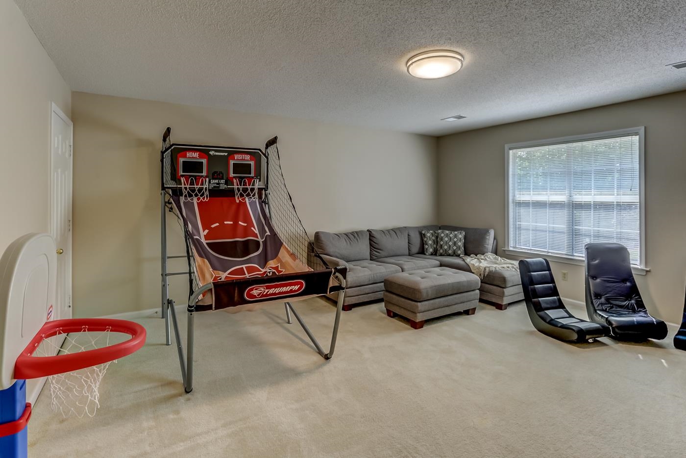 1091 Sugar Lane Collierville, TN 38017 - Photo 19 of 25 a living room with furniture a air conditioner vent and a window