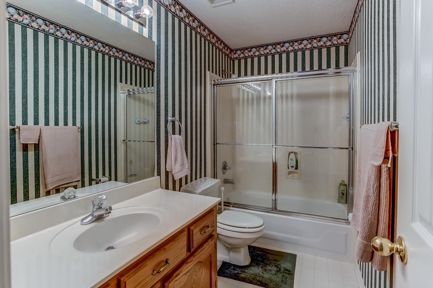 1091 Sugar Lane Collierville, TN 38017 - Photo 20 of 25 a bathroom with a sink toilet and shower