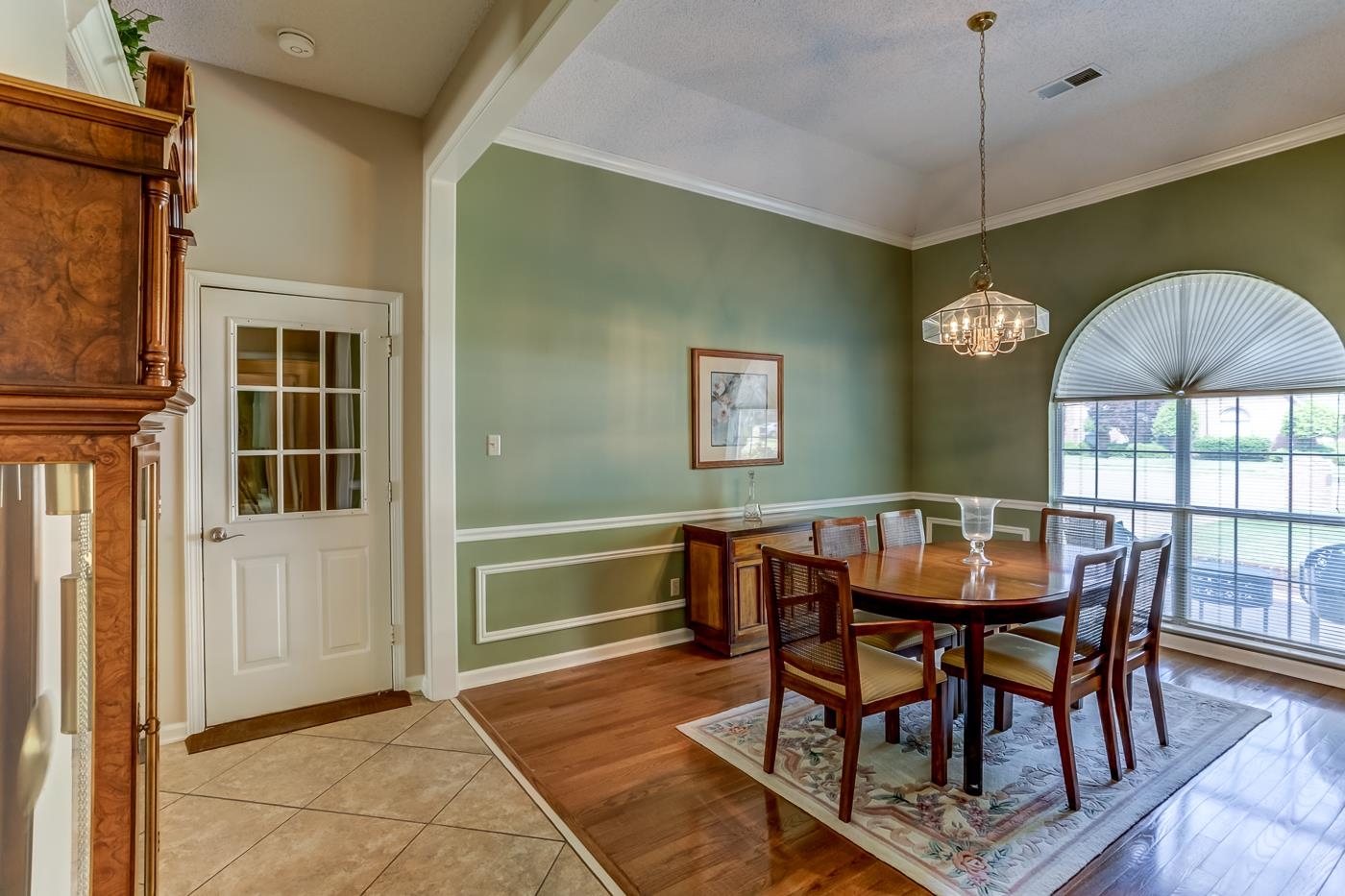 1091 Sugar Lane Collierville, TN 38017 - Photo 2 of 25 a view of a dining room with furniture window and wooden floor