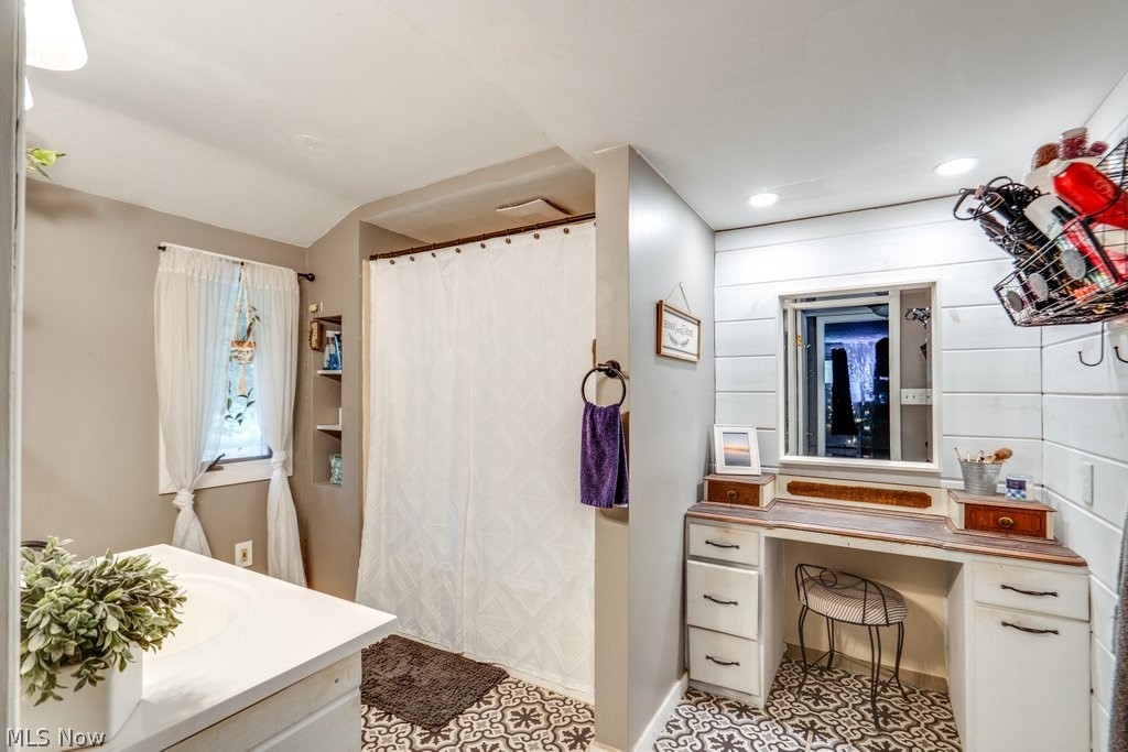 4219 Lake Rockwell Road Ravenna, OH 44266 - Photo 21 of 32 Bathroom featuring vanity and tile patterned floors