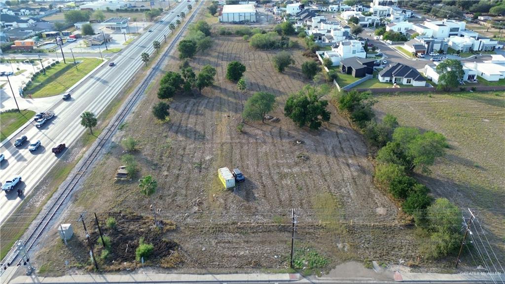 1001 North Shary Road Mission, TX 78573 - Photo 5 of 11 an aerial view of a house with a yard and lake view