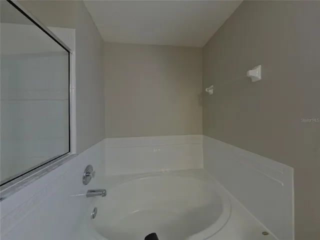 a white bath tub sitting in a bathroom