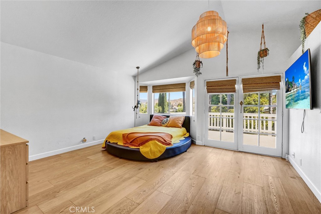 22411 Holly Court Saugus, CA 91390 - Photo 20 of 42 a bedroom with furniture and large windows