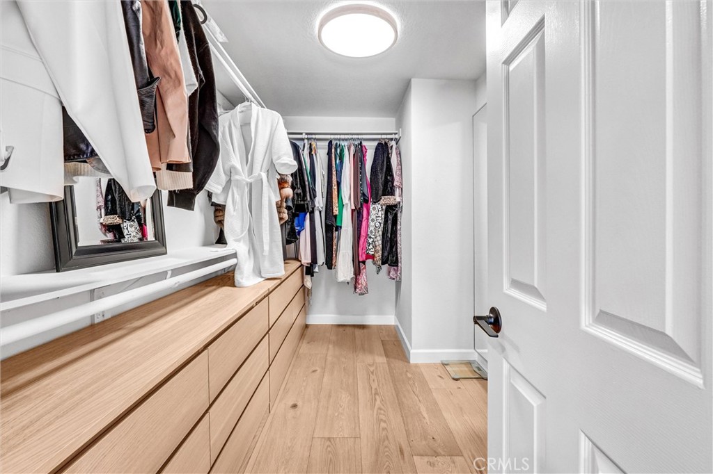 22411 Holly Court Saugus, CA 91390 - Photo 22 of 42 a view of a hallway with wooden floor and staircase
