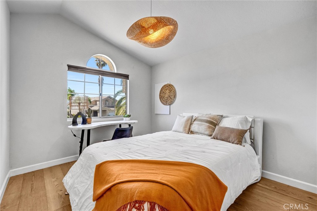 22411 Holly Court Saugus, CA 91390 - Photo 24 of 42 a bedroom with a bed and a window