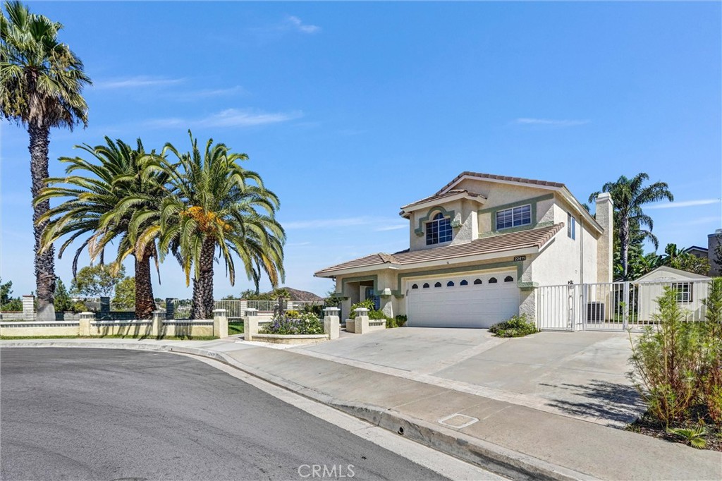 22411 Holly Court Saugus, CA 91390 - Photo 32 of 42 a front view of a building with palm trees
