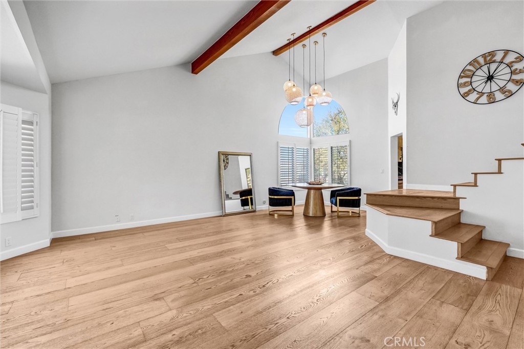 22411 Holly Court Saugus, CA 91390 - Photo 5 of 42 a view of a living room and kitchen with a large window