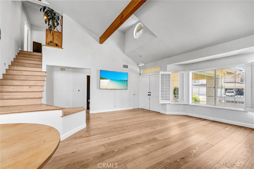 22411 Holly Court Saugus, CA 91390 - Photo 6 of 42 a view of an empty room with wooden floor and a window