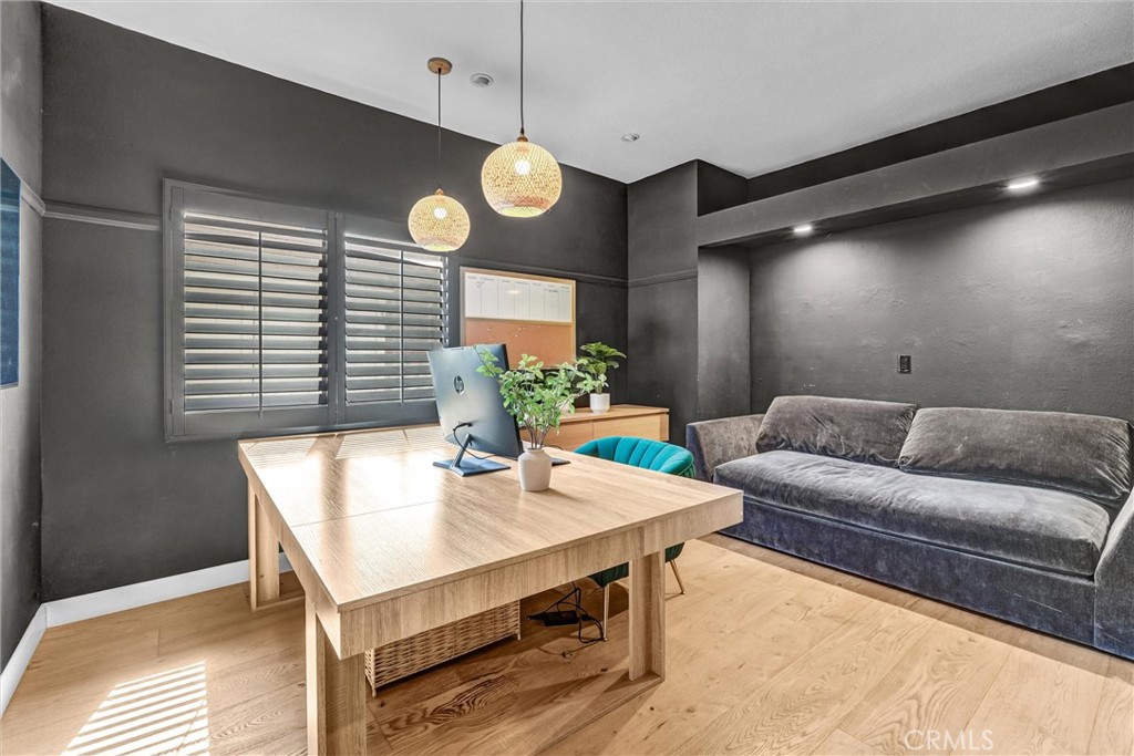 22411 Holly Court Saugus, CA 91390 - Photo 8 of 42 a living room with furniture kitchen view and a large window