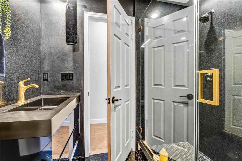 22411 Holly Court Saugus, CA 91390 - Photo 10 of 42 a kitchen with stainless steel appliances granite countertop a refrigerator and a sink