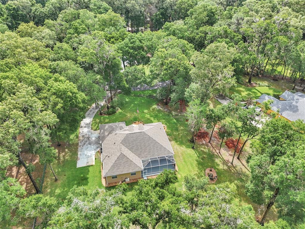 1989 Northwest 111th Loop Ocala, FL 34475 - Photo 48 of 55 an aerial view of a house with yard and outdoor seating
