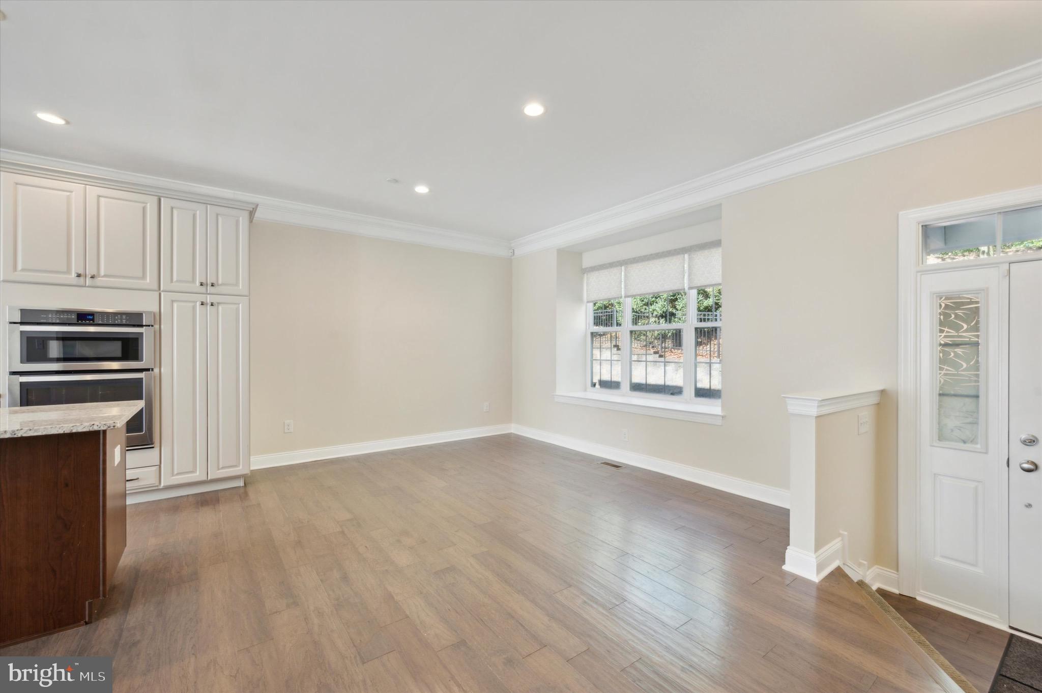 213 Avian Alley Springfield, PA 19064 - Photo 11 of 38 a view of kitchen with wooden floor electronic appliances and window