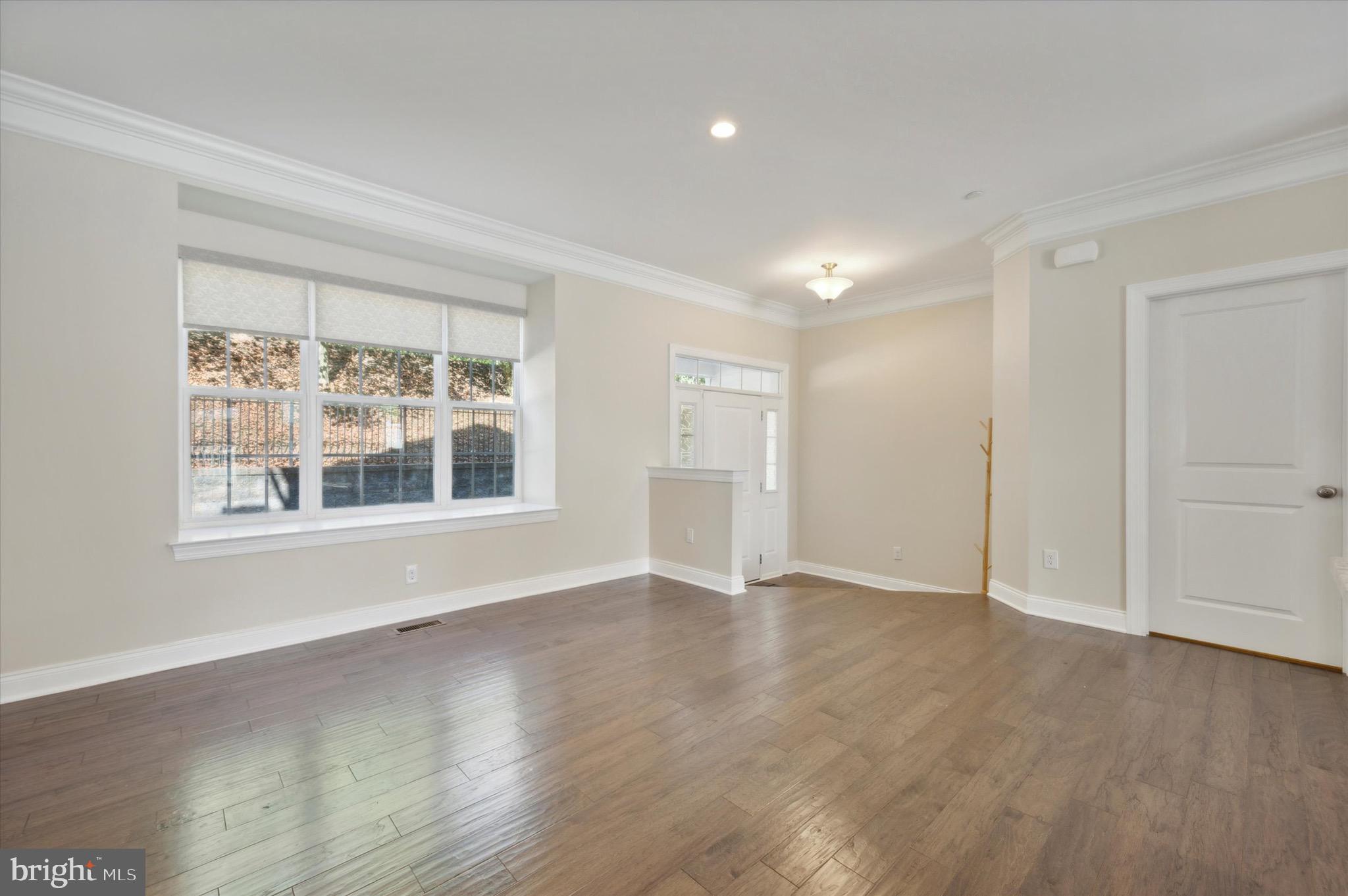 213 Avian Alley Springfield, PA 19064 - Photo 12 of 38 wooden floor in an empty room with a window