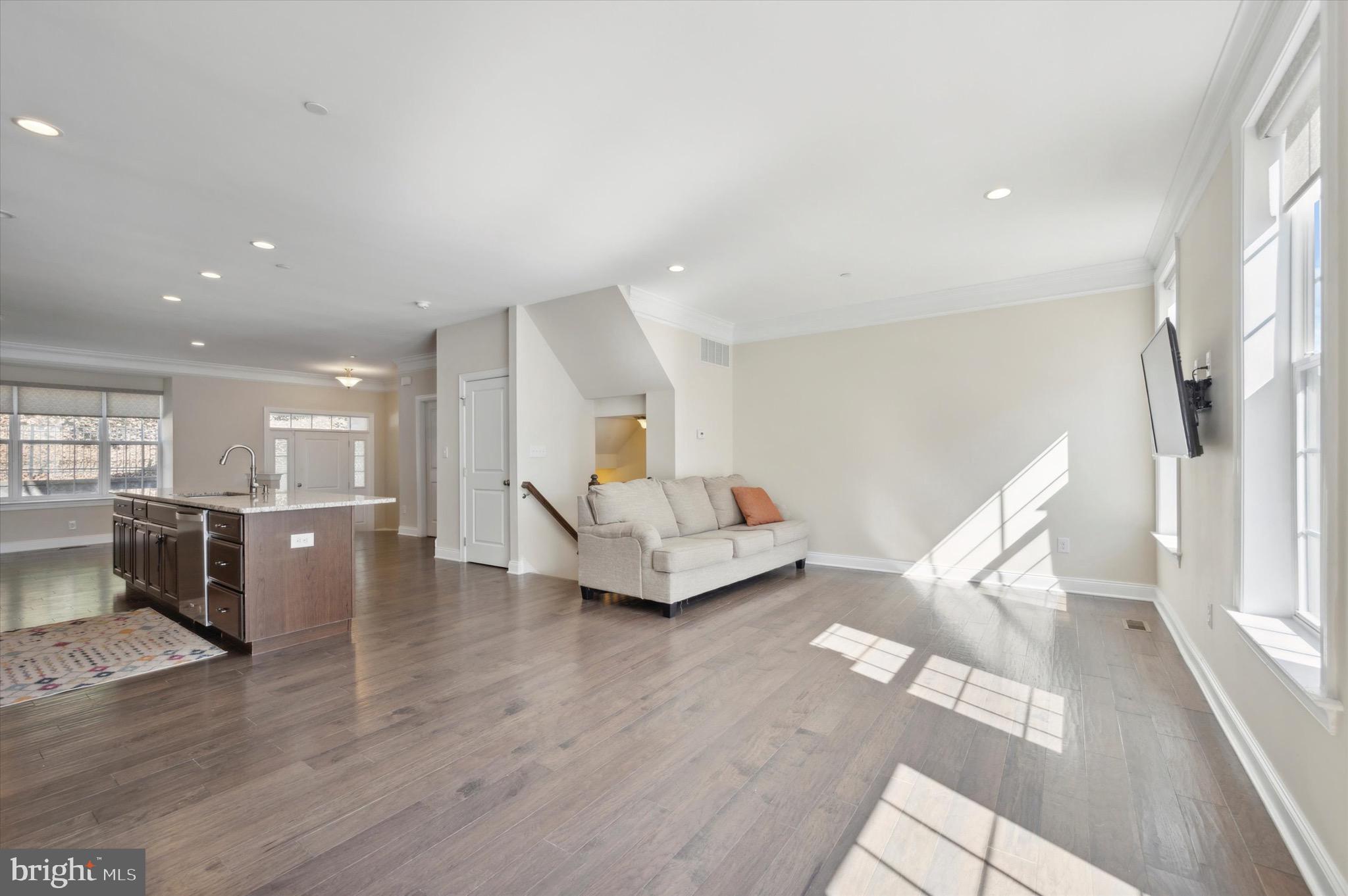 213 Avian Alley Springfield, PA 19064 - Photo 17 of 38 a living room with furniture and wooden floor