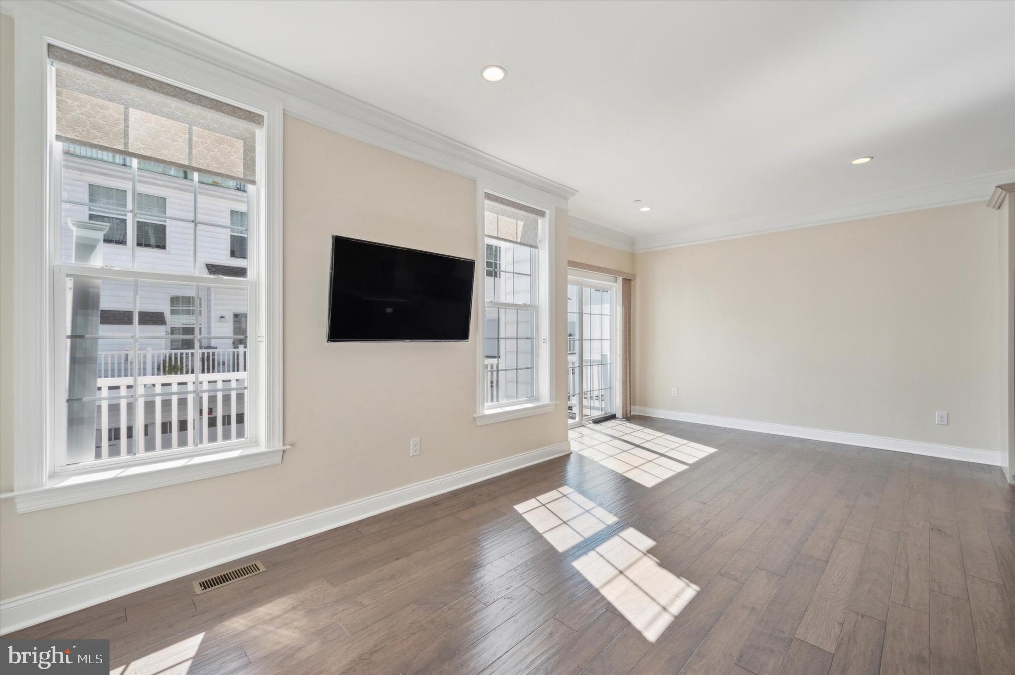 213 Avian Alley Springfield, PA 19064 - Photo 19 of 38 a view of livingroom with hardwood floor and window