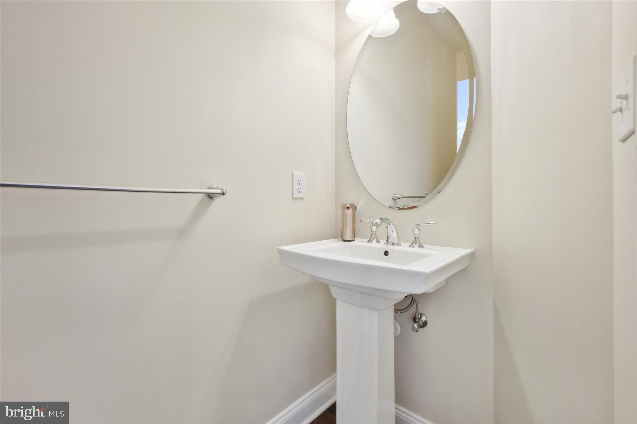 213 Avian Alley Springfield, PA 19064 - Photo 21 of 38 a bathroom with a sink and mirror