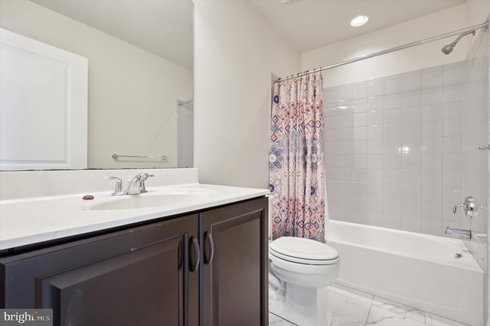 213 Avian Alley Springfield, PA 19064 - Photo 26 of 38 a bathroom with a sink a toilet and shower