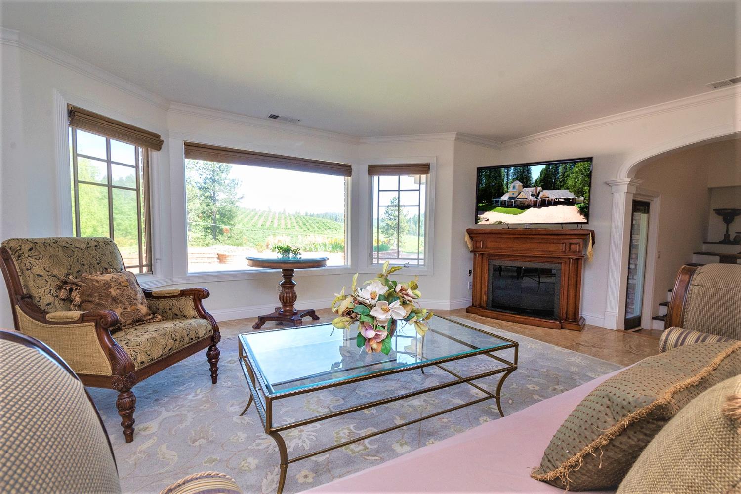 2640 Sky Ranch Lane Camino, CA 95709 - Photo 14 of 62 a living room with furniture fireplace and a large window