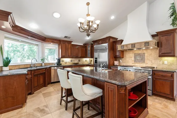 a view of a livingroom with wooden floor and stairs