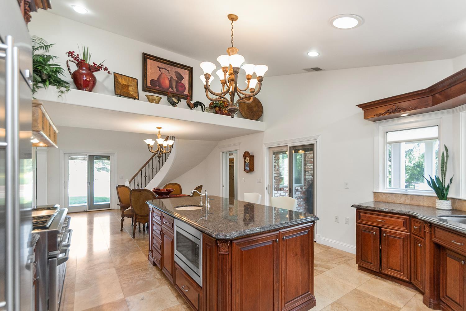 2640 Sky Ranch Lane Camino, CA 95709 - Photo 22 of 62 a kitchen room with granite countertop a stove and a sink