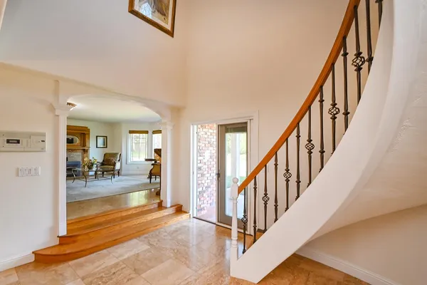 a spacious bedroom with a bed and a window