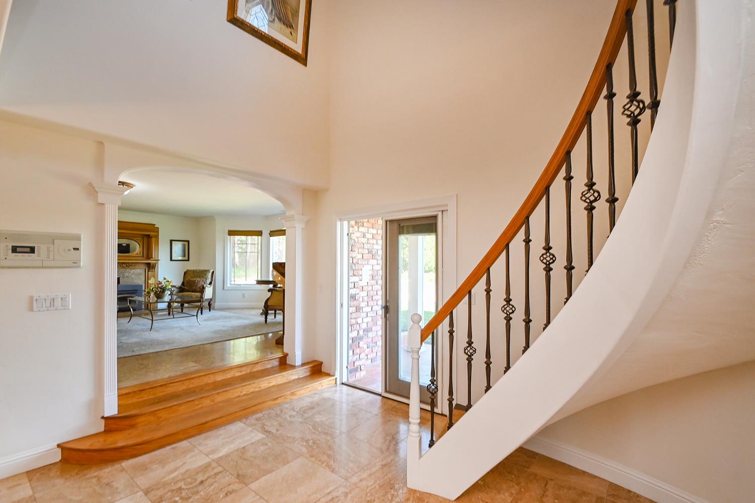 2640 Sky Ranch Lane Camino, CA 95709 - Photo 25 of 62 a view of a livingroom with wooden floor and stairs