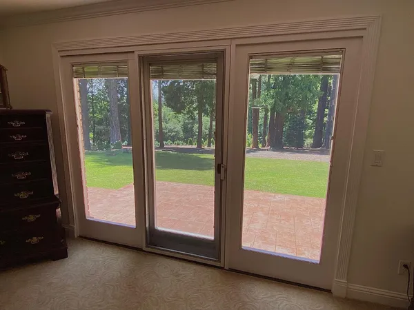 a bathroom with a shower and a sink