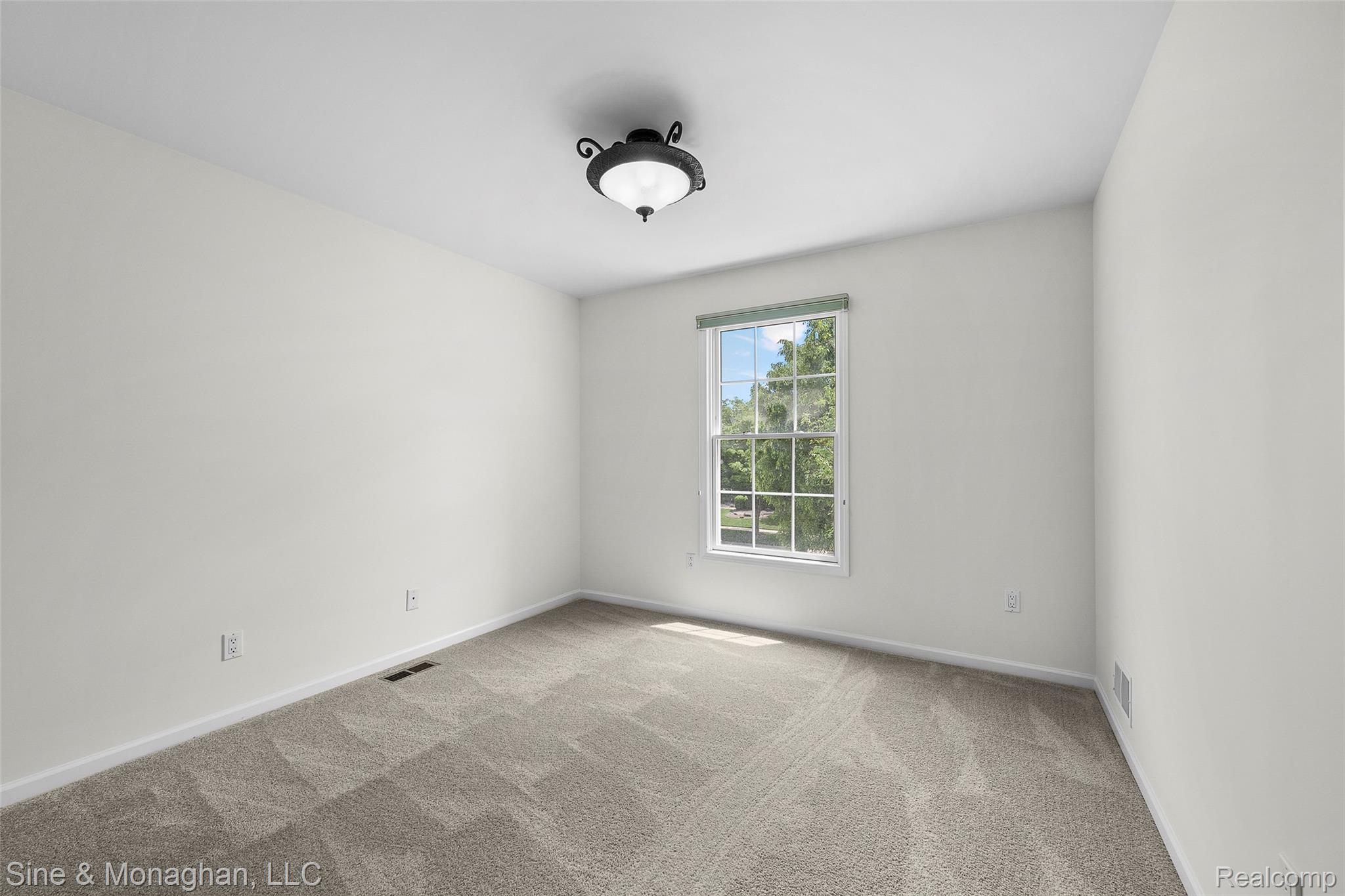 48322 Antique Road Canton, MI 48187 - Photo 32 of 45 Bright room featuring neutral carpeting and white wall paint