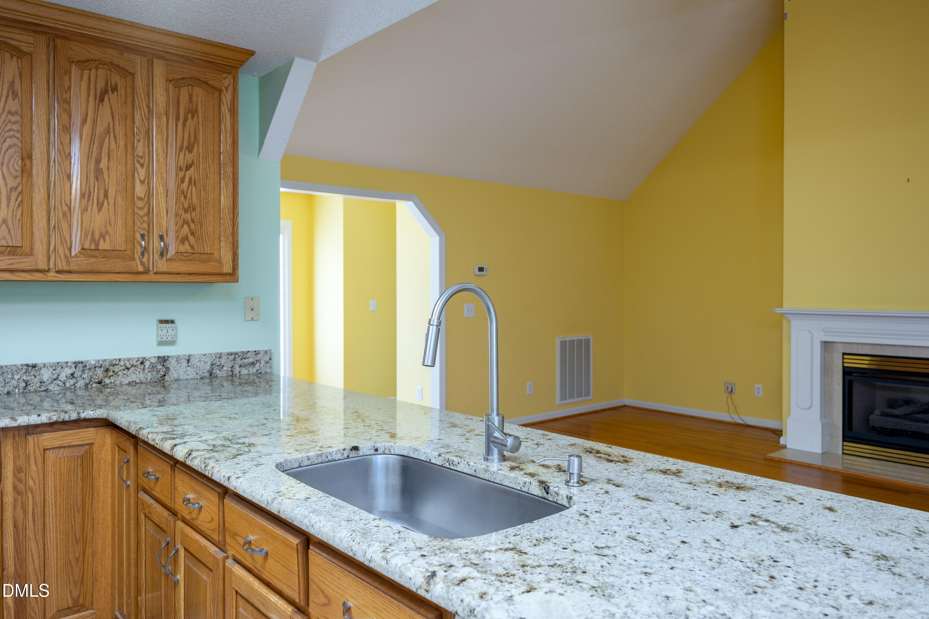 120 Line Drive Raleigh, NC 27603 - Photo 11 of 36 a kitchen with a sink and a wooden cabinets