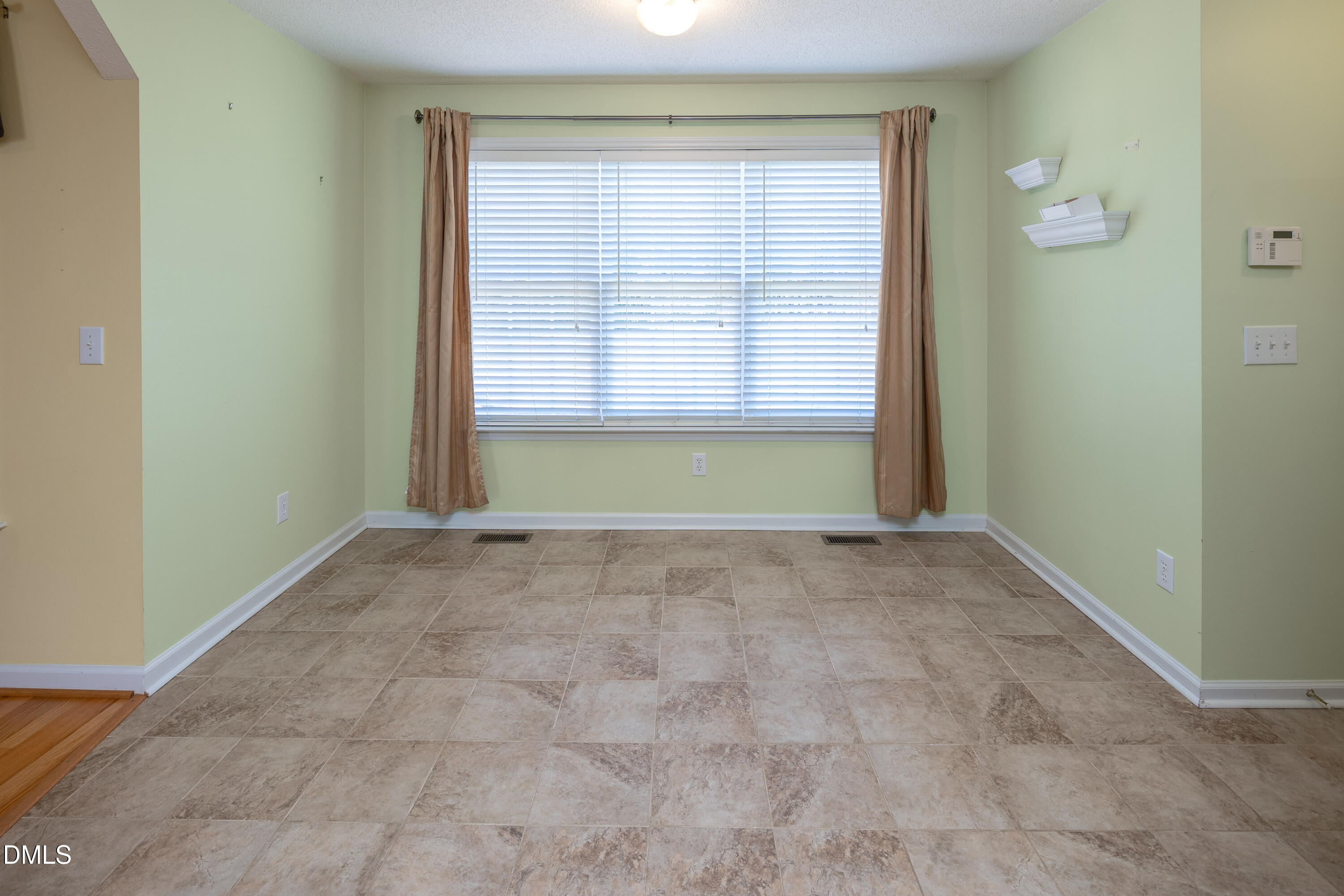120 Line Drive Raleigh, NC 27603 - Photo 12 of 36 a view of an empty room with a window