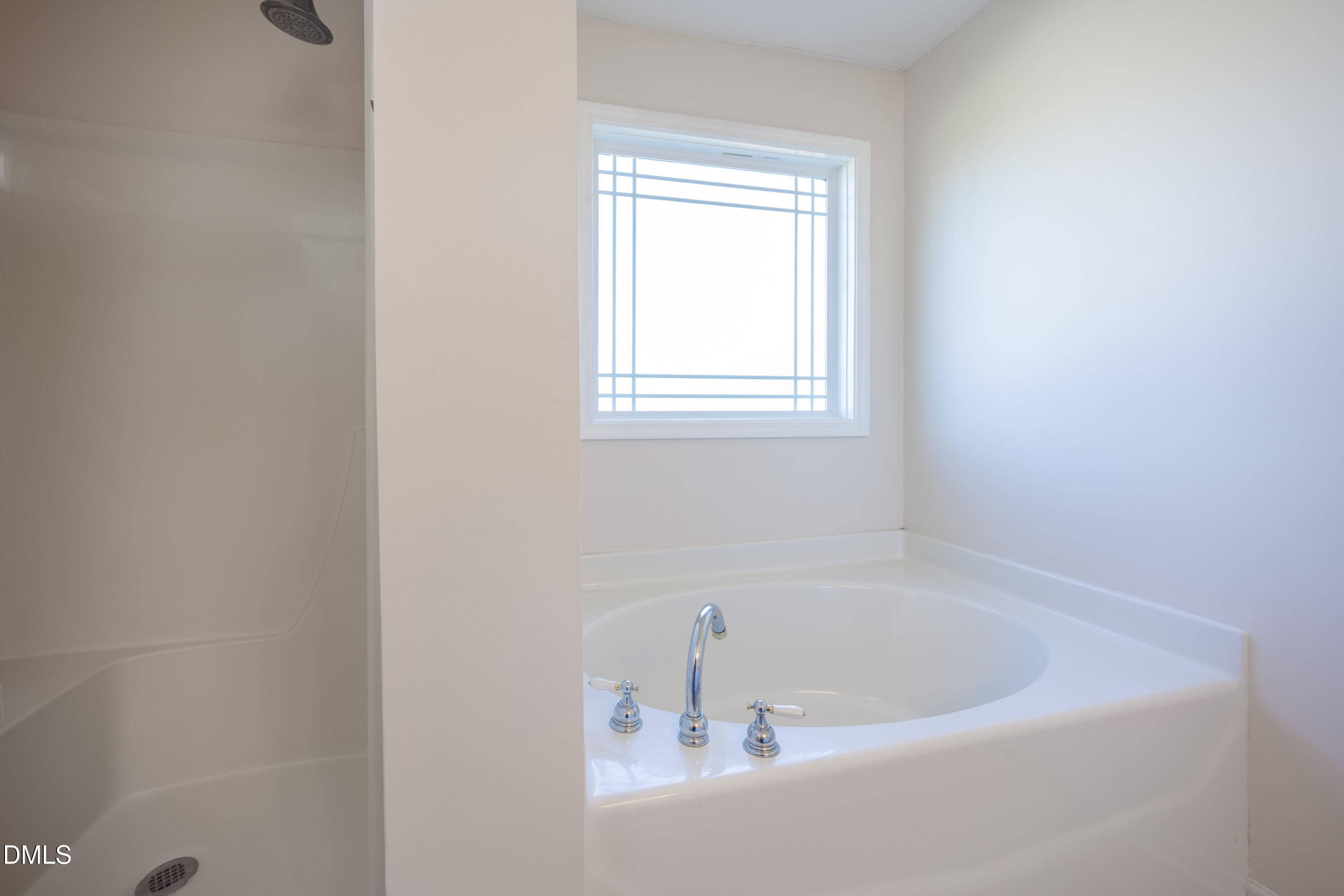 120 Line Drive Raleigh, NC 27603 - Photo 20 of 36 a white bath tub sitting in a bathroom