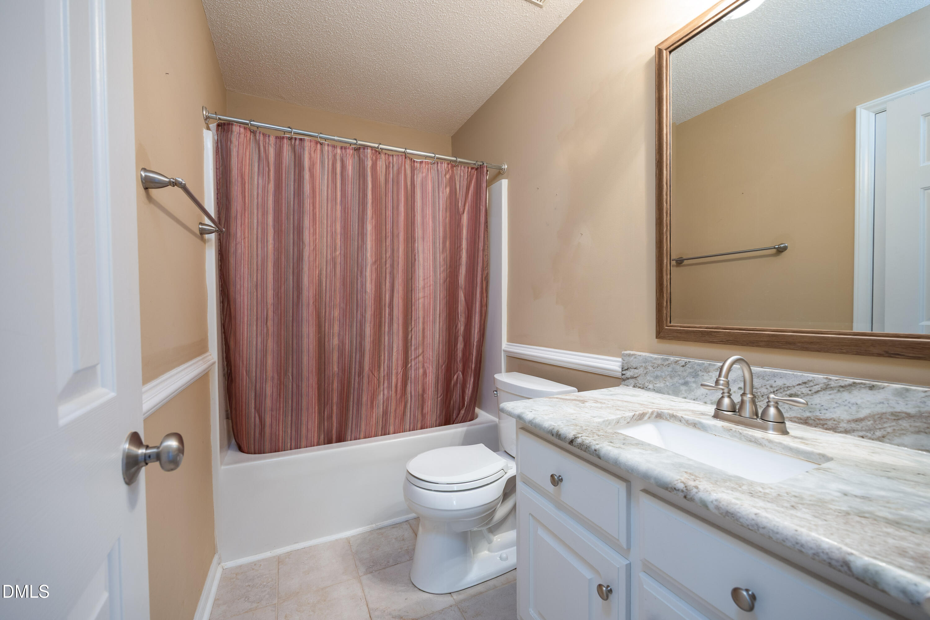 120 Line Drive Raleigh, NC 27603 - Photo 24 of 36 a bathroom with a granite countertop sink a toilet and a mirror