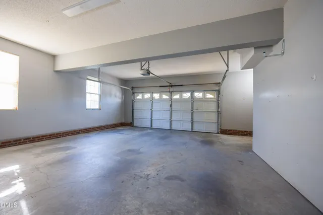 a view of empty room with windows