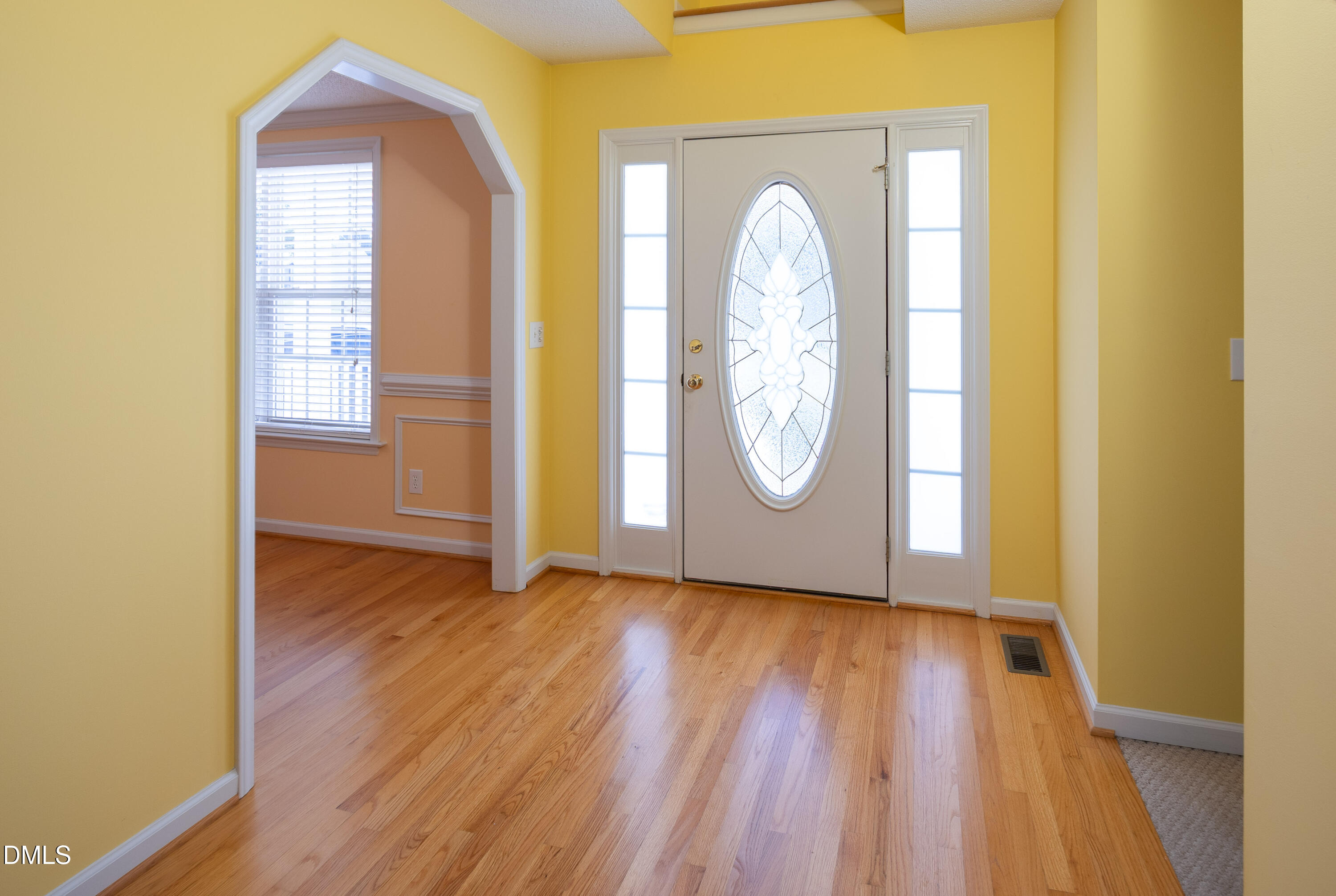 120 Line Drive Raleigh, NC 27603 - Photo 4 of 36 a view of a room with wooden floor and door