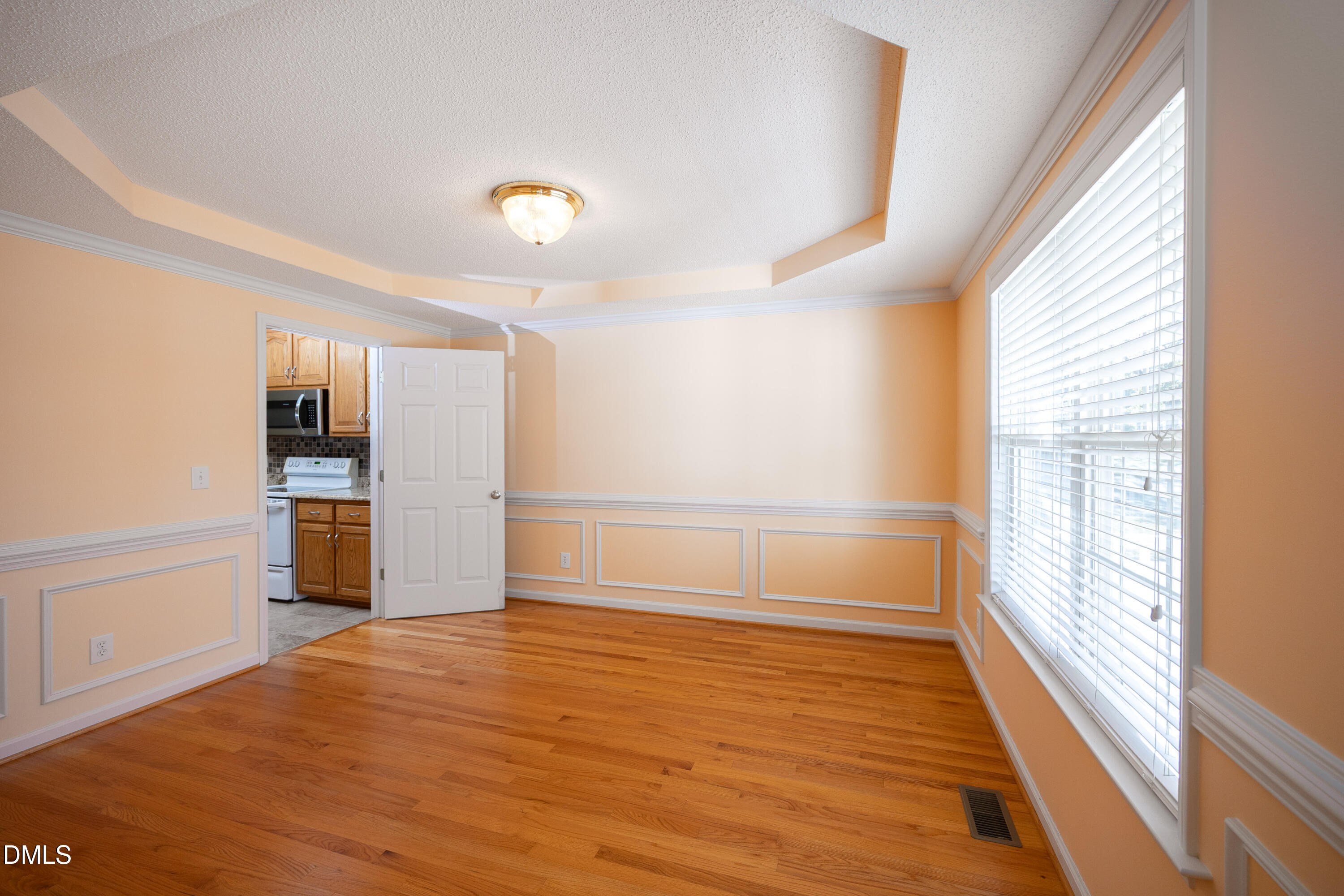 120 Line Drive Raleigh, NC 27603 - Photo 6 of 36 a view of empty room with wooden floor and fan