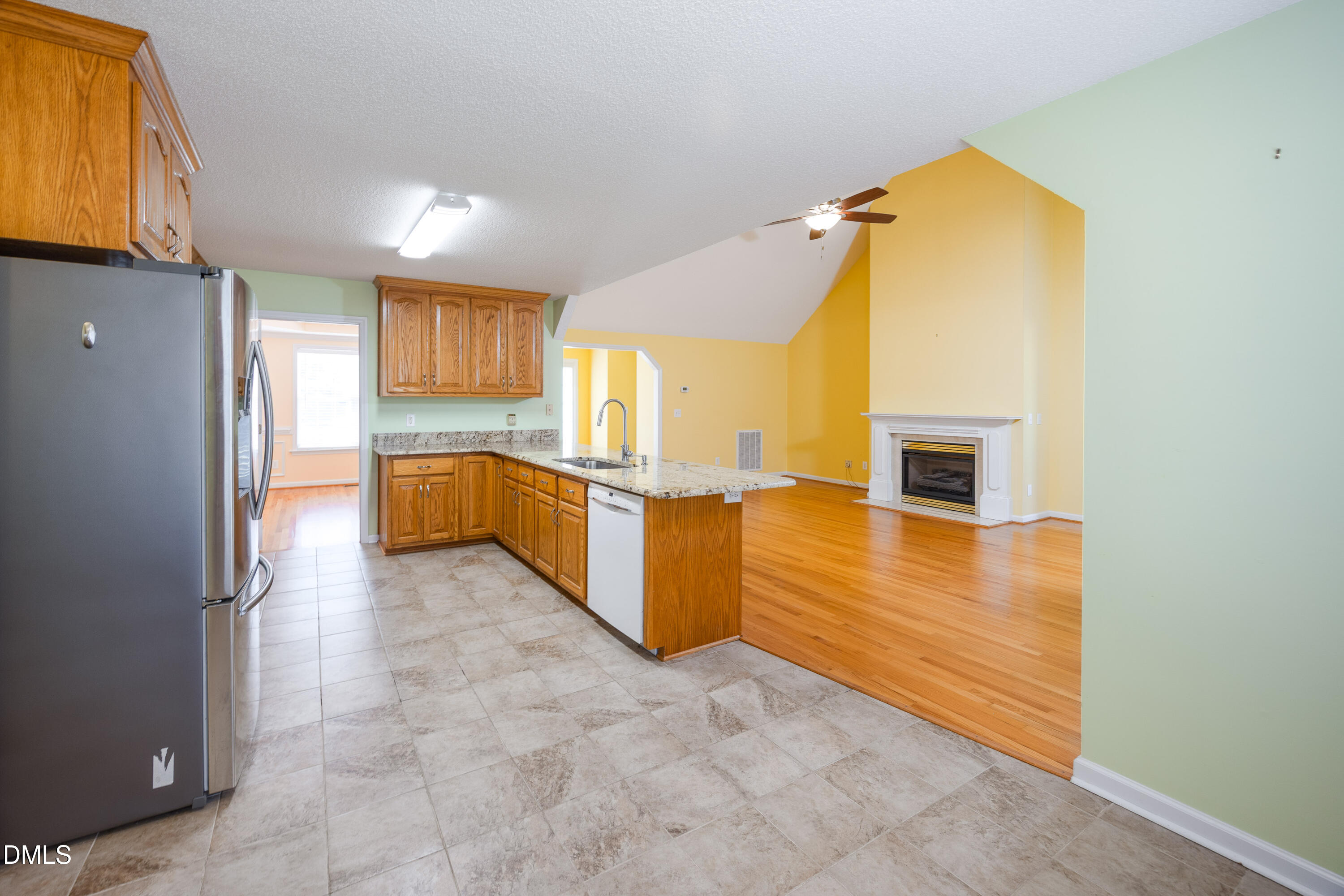 120 Line Drive Raleigh, NC 27603 - Photo 8 of 36 a view of a kitchen with a sink and a refrigerator