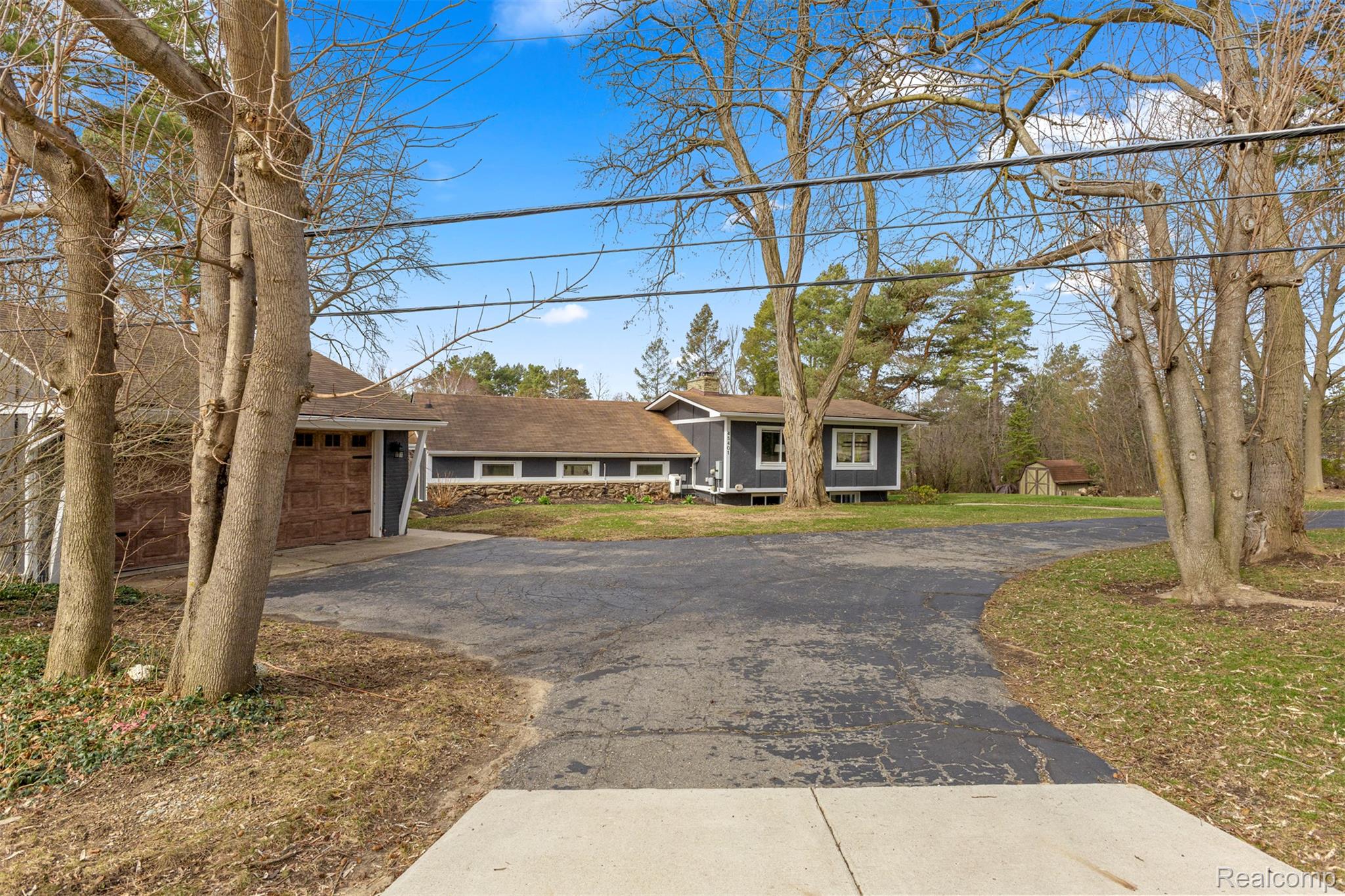 45401 West 9 Mile Road Novi, MI 48374 - Photo 54 of 67 View of front of home with driveway and a front lawn