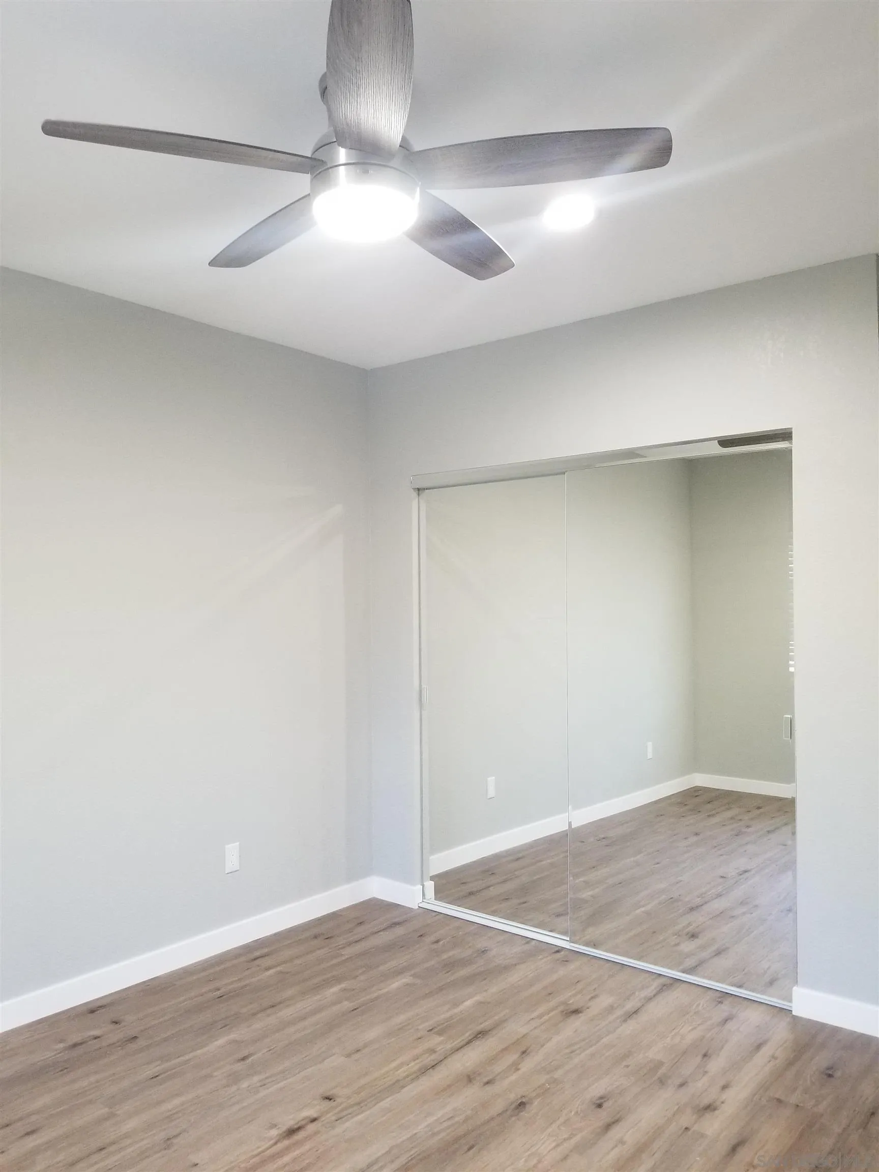 5051 63rd Street San Diego, CA 92115 - Photo 24 of 28 a view of an empty room with wooden floor