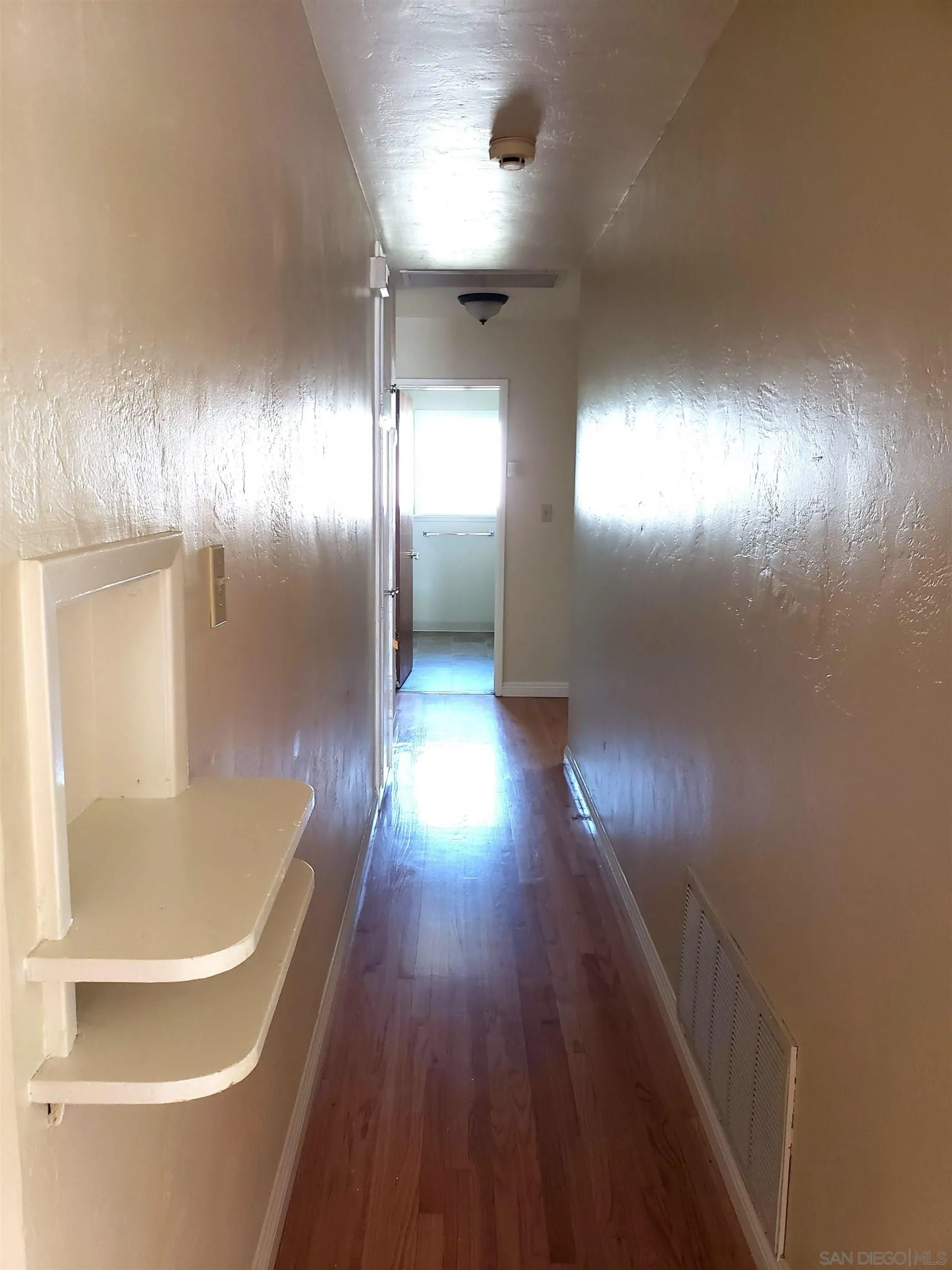 5051 63rd Street San Diego, CA 92115 - Photo 7 of 28 a view of empty room with wooden floor