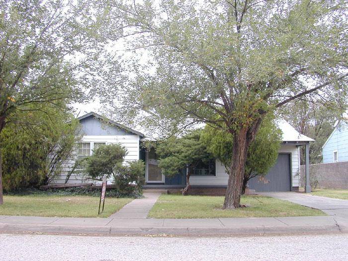 4010 South Lipscomb Street Amarillo, TX 79110 - Photo 1 of 1 a tree in front of a white house