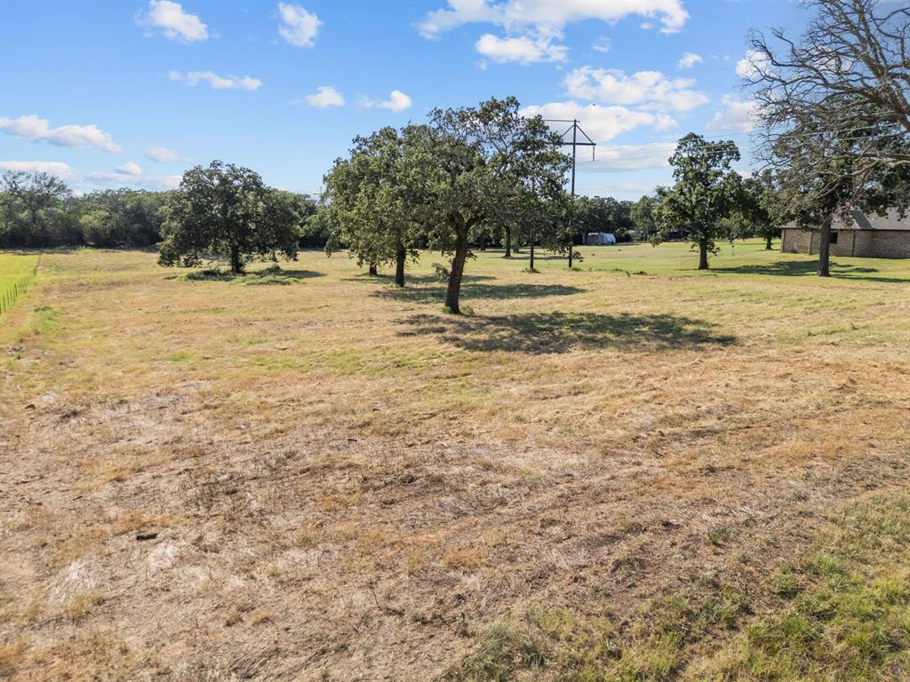 112 Aslan Road Poolville, TX 76487 - Photo 11 of 11 View of grassy yard featuring a view of countryside