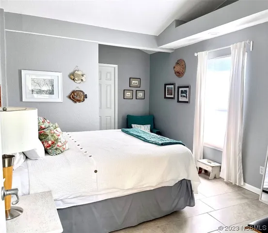 a bedroom with a bed and a cabinets