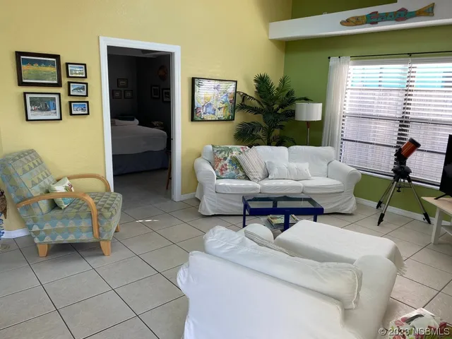 a living room with furniture and window